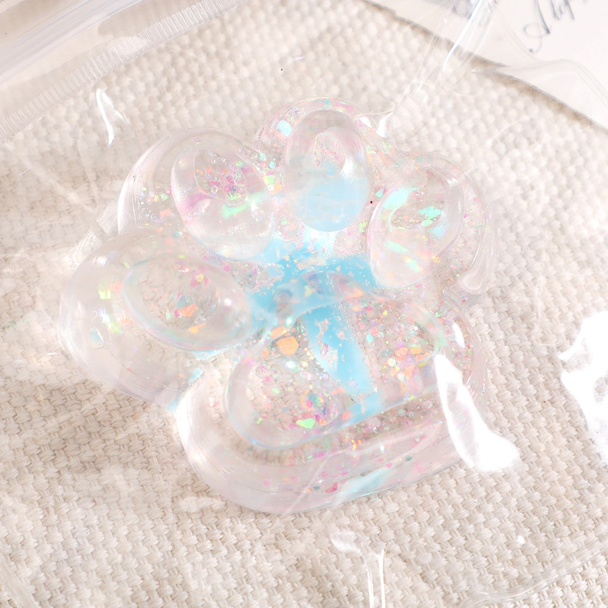 Jucarie Antistres Squishy, Klevo, cu Revenire Lenta, Squeeze Pinch Family, Model Cat Paw, 6.5 x 7 cm, din Tpr, 4-6 Ani, Model 2 Flori, Transparent