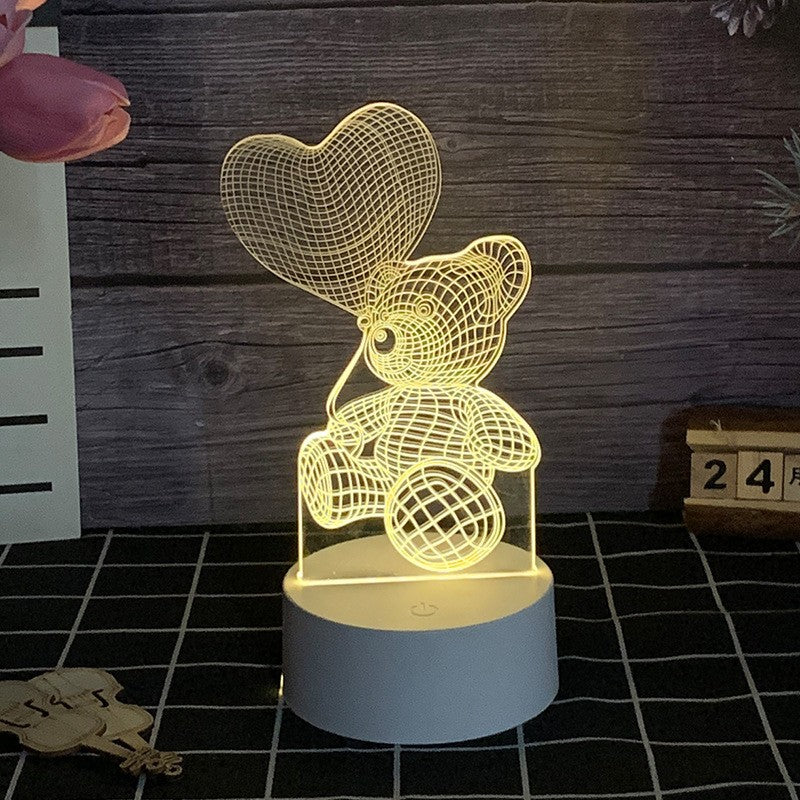 Lampa LED decorativa, Klevo, 3D, Ursulet cu balon inima, cu telecomanda, doua moduri de alimentare USB si baterii, 20 cm inaltime, din material acril si lumina multicolora, alb