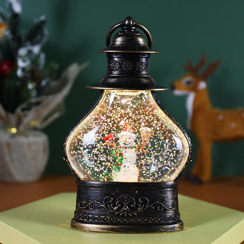 Decoratiune de Craciun tip Felinar, Klevo, Glob de Cristal cu Fulgi de Zapada, Model Om de Zapada, Ornamentat cu Luminite Interioare, 14.5 x 9 x 3 cm, Rama Neagra, Transparent