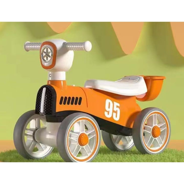 Bicicleta fara pedale pentru copii Klevo, cu lumini si muzica, 4 roti, varsta 1-3 ani, material PP, 63 x24 x41 cm, portocaliu