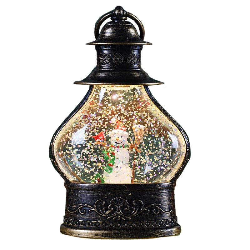 Decoratiune de Craciun tip Felinar, Klevo, Glob de Cristal cu Fulgi de Zapada, Model Om de Zapada, Ornamentat cu Luminite Interioare, 14.5 x 9 x 3 cm, Rama Neagra, Transparent