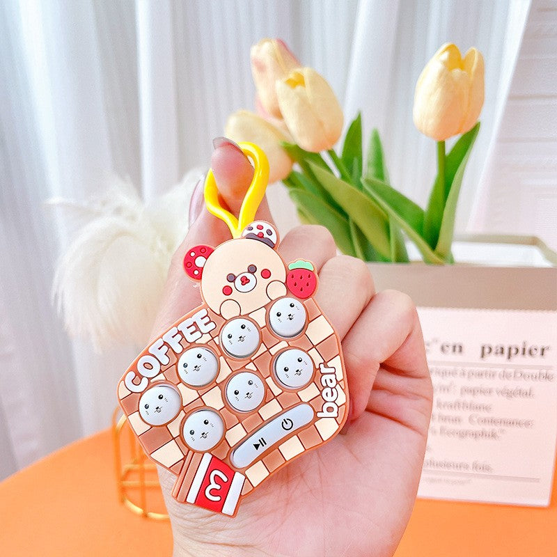 Jucarie pentru copii portabila Klevo, joc Gopher, cu lumini si muzica, tip breloc, model ursulet, material silicon si ABS, maro